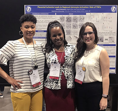 Junie Warrington, PhD, with her students Ahsia Clayton and Ashtin Giambrone in front of a scientific poster at the 2018 EB meeting. The poster is about Placental Ischemia.